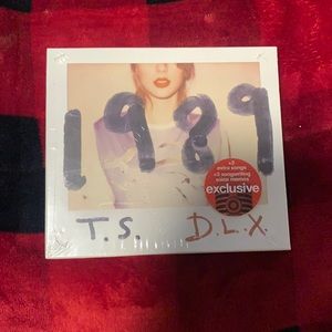 Taylor Swift “1989” album on a CD